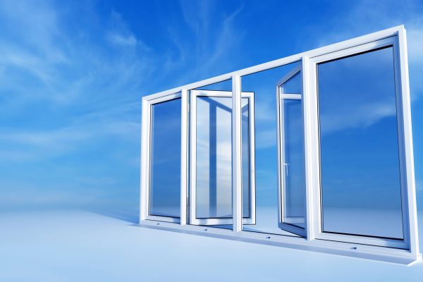 Biale okna PCV na tle niebieskiego nieba