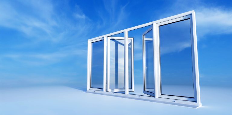 Biale okna PCV na tle niebieskiego nieba